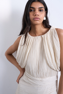 Front image of a model wearing the Svea drape mini dress in beige, by brand Top shop