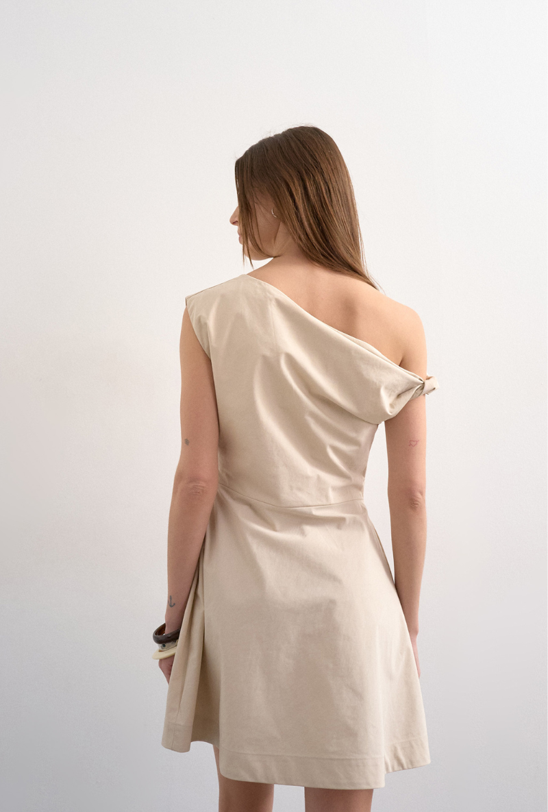 Back image of a model wearing Zenia mini dress in ecru, by brand Top shop