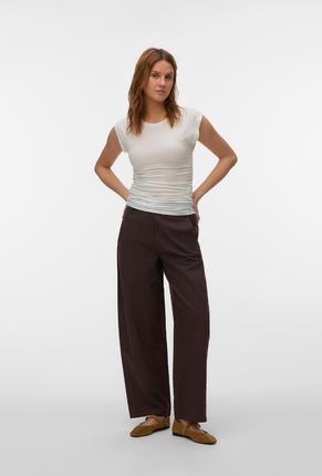 Front image of a model wearing Ava sarah top in white, by brand Vero moda