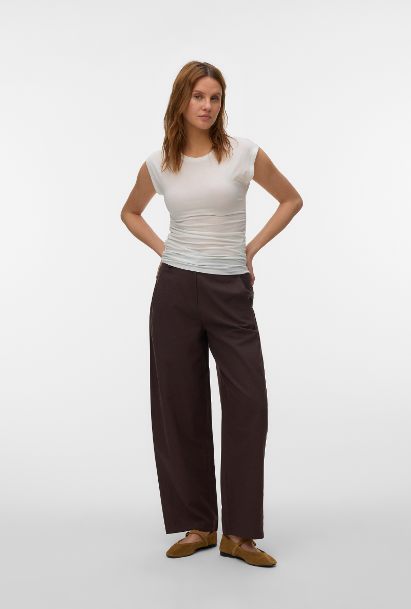Front image of a model wearing Ava sarah top in white, by brand Vero moda
