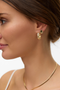 Front image of a model wearing Chelly earrings 2 pk in gold, by brand Vero moda