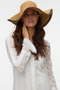 Front image of a model wearing Emmy sun hat in natural, by brand Vero moda