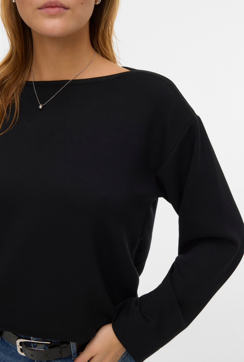 Detail image of a model wearing Vero moda hali l/s boat neck top in black, by brand Vero moda