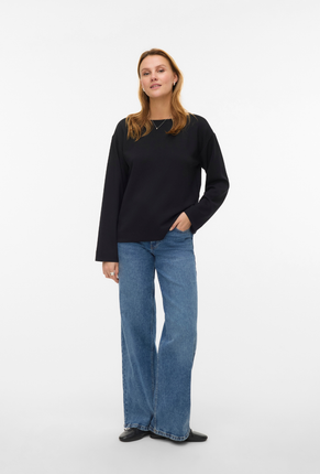 Front image of a model wearing Vero moda hali l/s boat neck top in black, by brand Vero moda