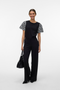 Front image of a model wearing Jasy o neck top in black, by brand Vero moda