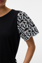 Front image of a model wearing the Jasy o neck top in black, by brand Vero moda