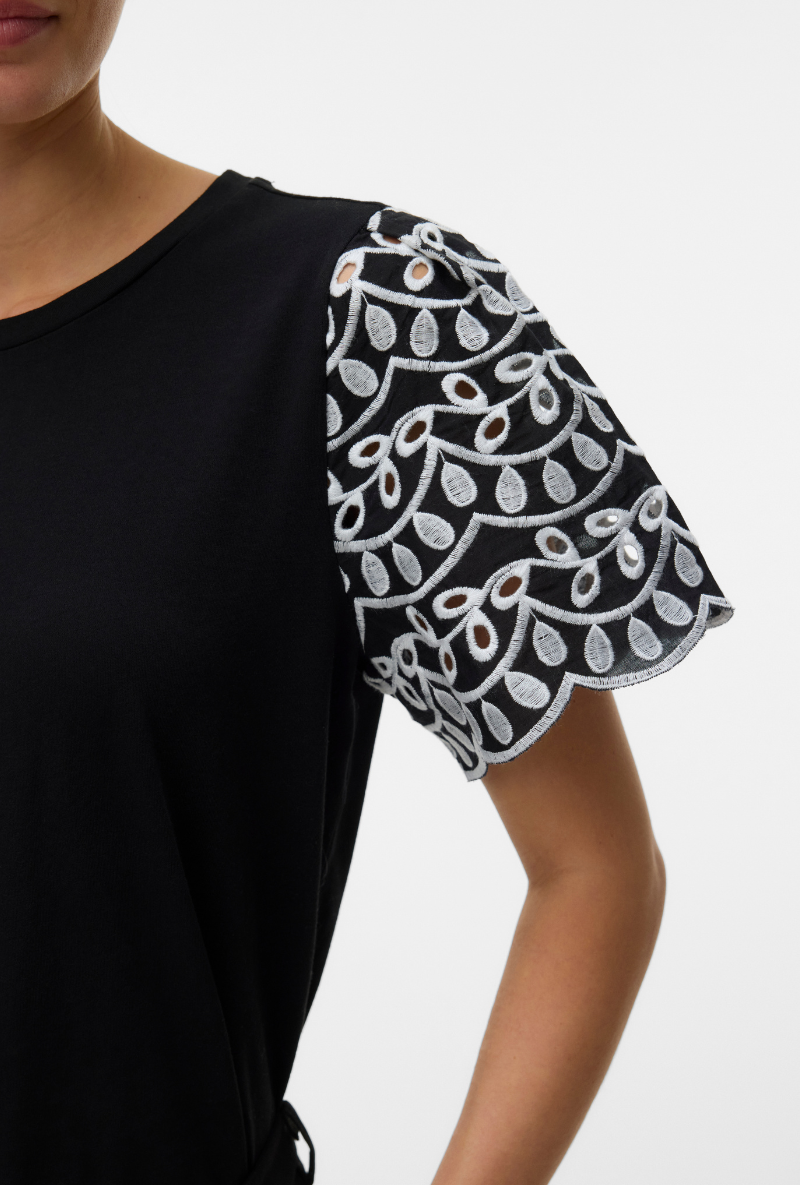 Front image of a model wearing Jasy o neck top in black, by brand Vero moda