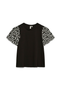 Front image of a model wearing the Jasy o neck top in black, by brand Vero moda