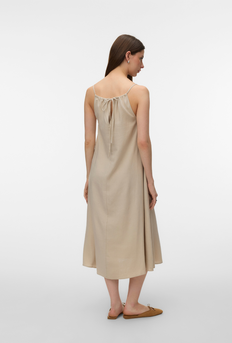 Back image of a model wearing Jesmilo calf singlet dress in beige, by brand Vero moda
