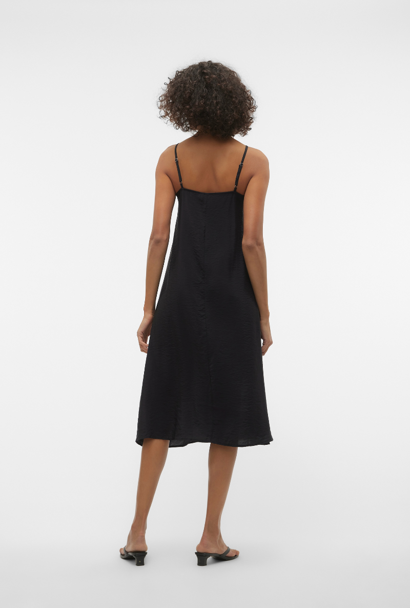 Back image of a model wearing Josie calf singlet dress in black, by brand Vero moda