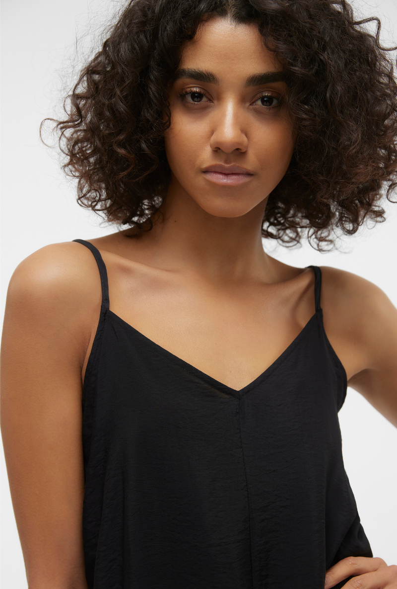Front detail image of a model wearing Josie calf singlet dress in black, by brand Vero moda