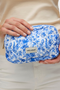 Front detail image of a model wearing Joy toilet bag in blue, by brand Vero moda