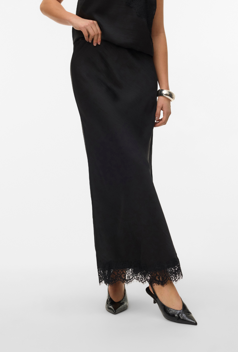 Front image of a model wearing Vero moda julia hw lace maxi skirt in black, by brand Vero moda