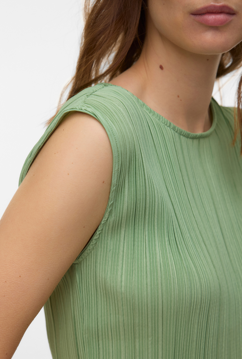 Front detail image of a model wearing Malene sl oneck top in green, by brand Vero moda