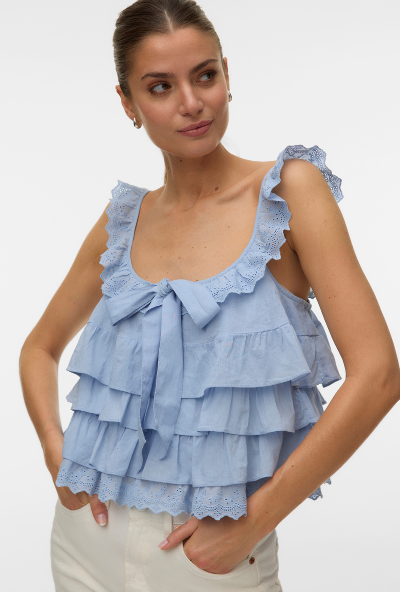 Front image of a model wearing Sandy layered top in blue, by brand Vero moda