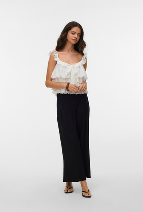 Front image of a model wearing Sandy layered top in white, by brand Vero moda