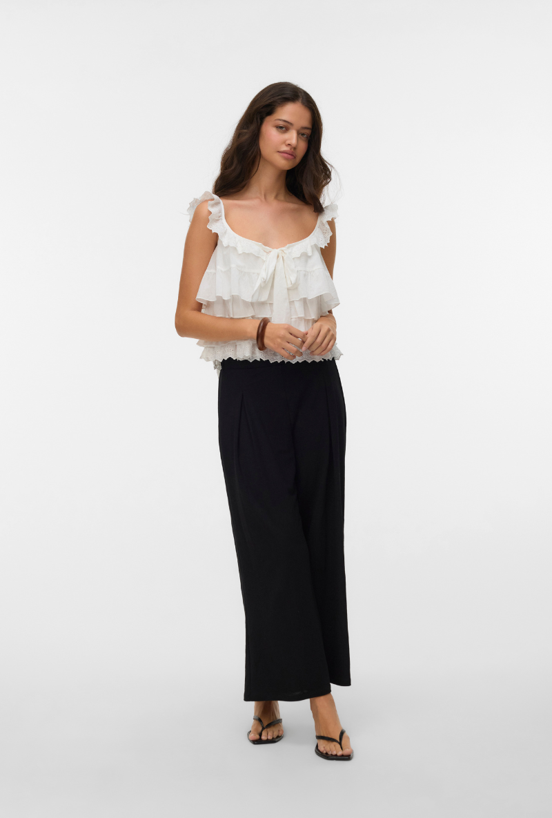Front image of a model wearing Sandy layered top in white, by brand Vero moda