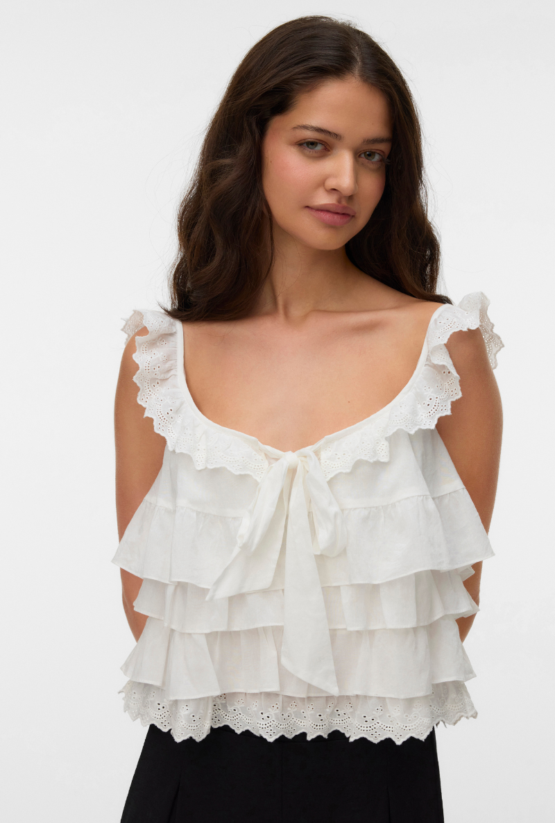 Front image of a model wearing Sandy layered top in white, by brand Vero moda