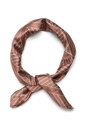 Folded image of the Mia square scarf in rust, by brand Vero moda
