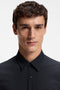Front image of a model wearing the Authentic tshirt in navy, by brand Boss