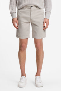 Front image of a model wearing the Chino slim shorts in light grey, by brand Boss