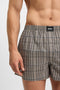Front image of a model wearing the Cw peach 2 pk boxer shorts in black, by brand Boss