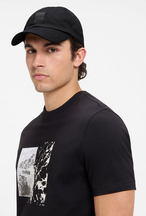 Front image of a model wearing the Derrel cap in black, by brand Boss