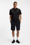 Front image of a model wearing the Globe logo tshirt in black, by brand Boss