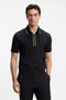 Front image of a model wearing Philix zip polo in black, by brand Boss