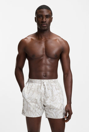 Front image of a model wearing Piranha swimshorts in beige, by brand Boss
