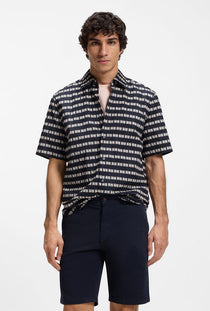Front image of a model wearing the Rash 2 aop ss shirt in navy, by brand Boss