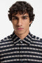 Front image of a model wearing the Rash 2 aop ss shirt in navy, by brand Boss