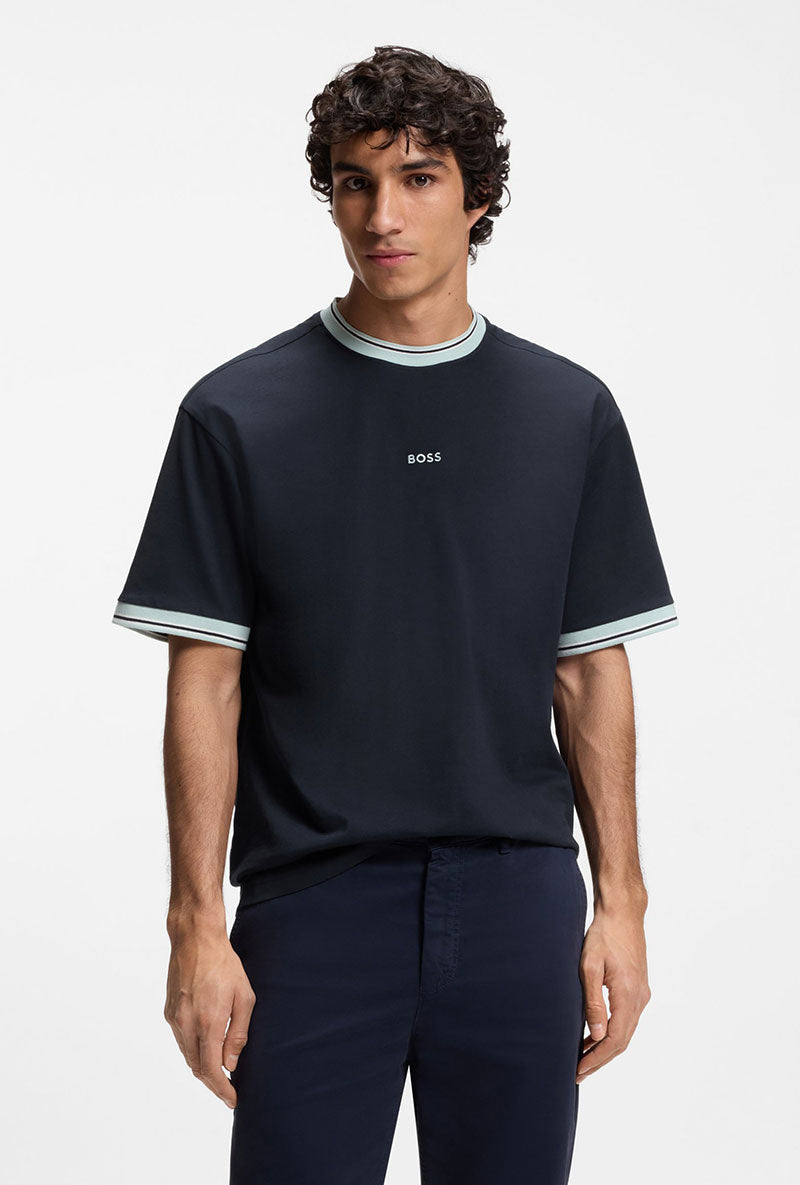 Front image of a model wearing Te blocks tshirt in navy, by brand Boss