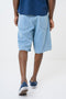 Back image of a model wearing the Mason bermuda shorts in denim, by brand Hugo