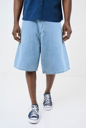 Front image of a model wearing the Mason bermuda shorts in denim, by brand Hugo