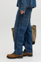 Side image of a model wearing the Jack and jones alex norrebro jeans in denim, by brand Jack&jones