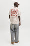 Back image of a model wearing the Art print tee in beige, by brand Jack&jones