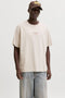 Front image of a model wearing Art print tee in beige, by brand Jack&jones