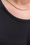 Close up image of a model wearing the Jack and jones basic tanktop in black, by brand Jack&jones