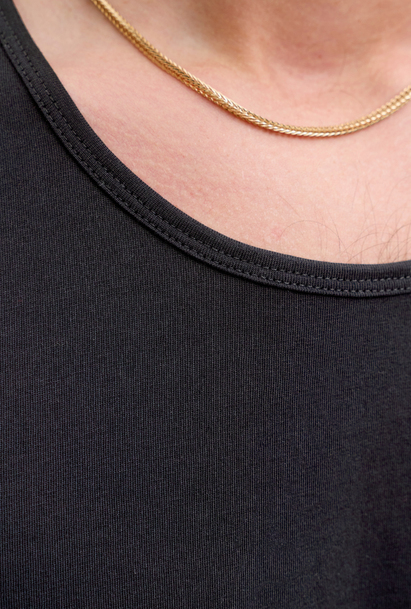 Close up image of a model wearing Jack and jones basic tanktop in black, by brand Jack&jones