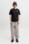 Front image of a model wearing the Brewy ss tee in black, by brand Jack&jones