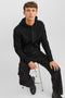 Front image of a model wearing the Bradley sweat zip hood in black, by brand Jack&jones