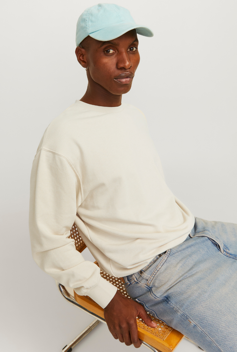 Front image of a model wearing Jack and jones charge sweatshirt in beige, by brand Jack&jones