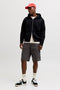 Front image of a model wearing the Cole matty cargo shorts in charcoal, by brand Jack&jones