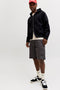 Front image of a model wearing the Cole matty cargo shorts in charcoal, by brand Jack&jones