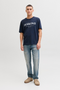 Front image of a model wearing Jack and jones daytona print tee in navy, by brand Jack&jones