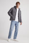 Front image of a model wearing the Galaxy puffer jacket in charcoal, by brand Jack&jones