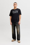 Front image of a model wearing Jack and jones jeff logo tee in black, by brand Jack&jones
