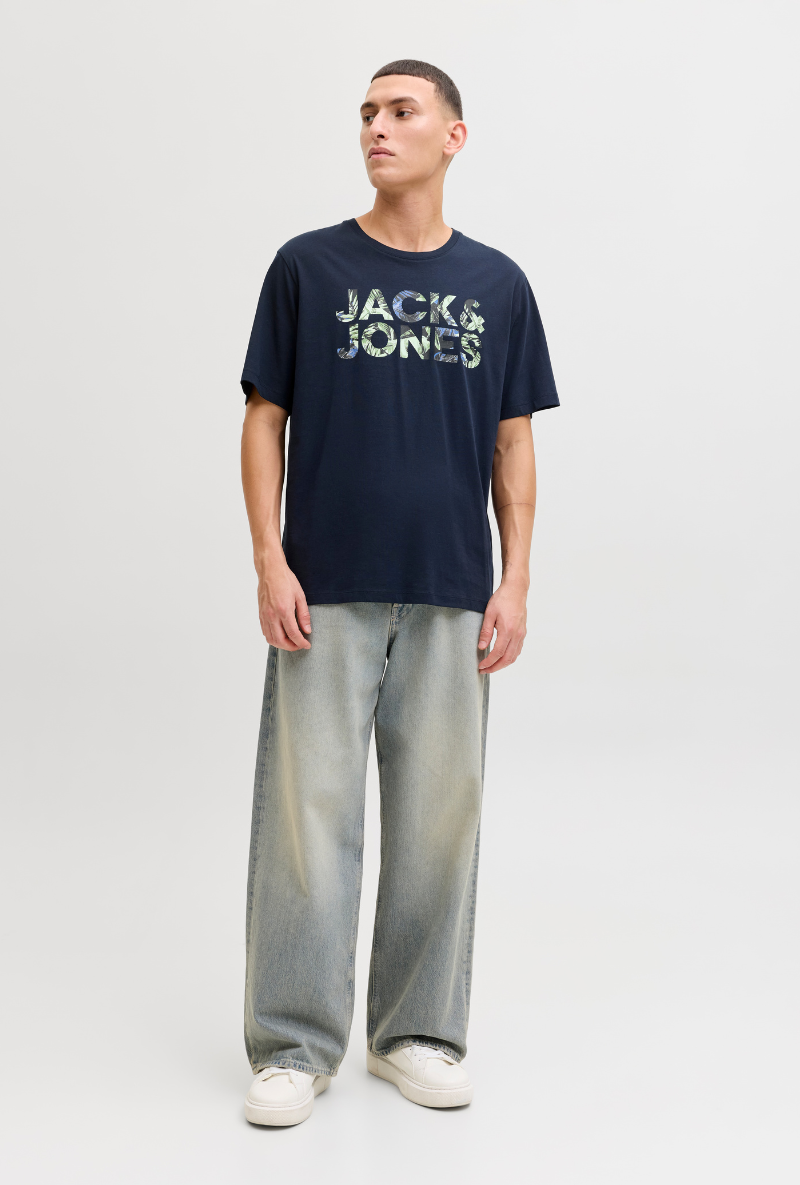 Front image of a model wearing Jack and jones jeff logo tee in navy, by brand Jack&jones