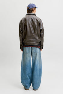 Back image of a model wearing the Marlon pu jacket in brown, by brand Jack&jones